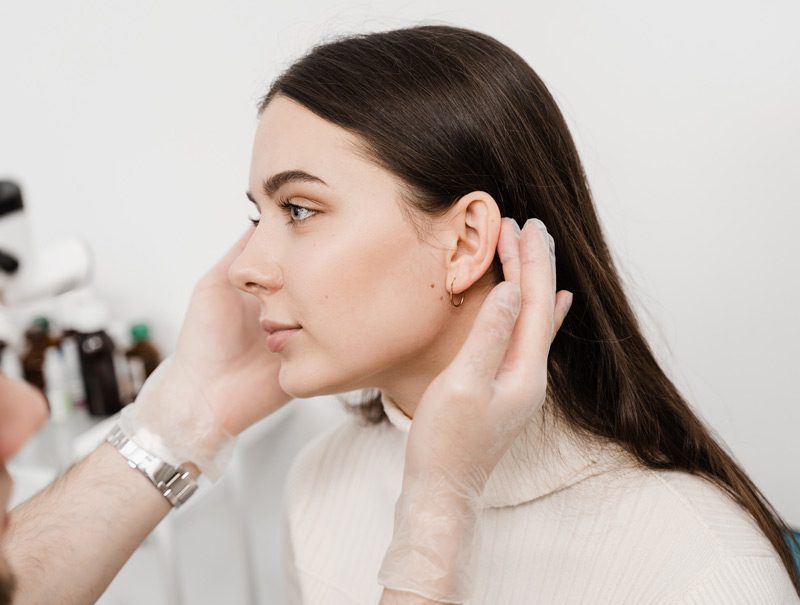 patient-getting-checked-after-otoplasty