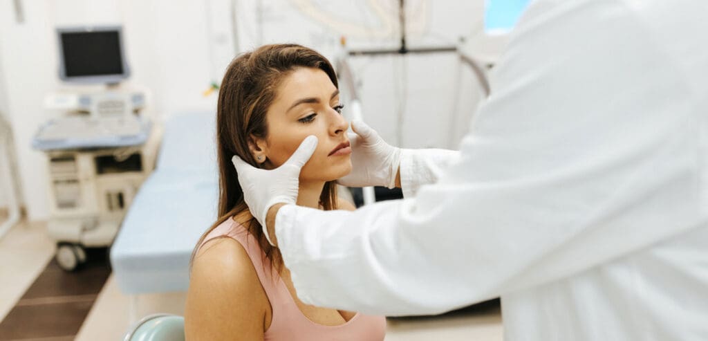 patient-in-an-exam-chair-being-examined-by-a-specialist