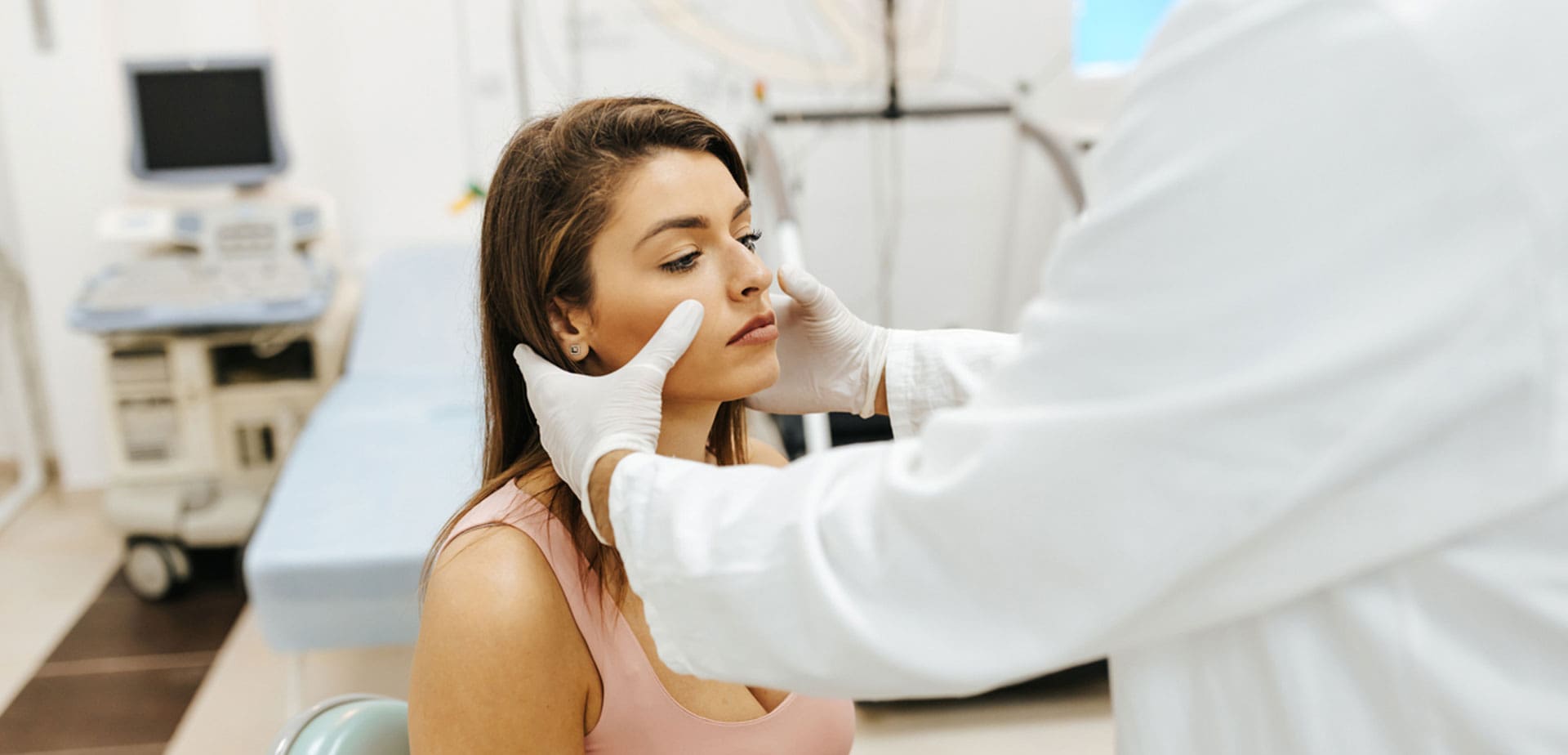 patient-in-an-exam-chair-being-examined-by-a-specialist